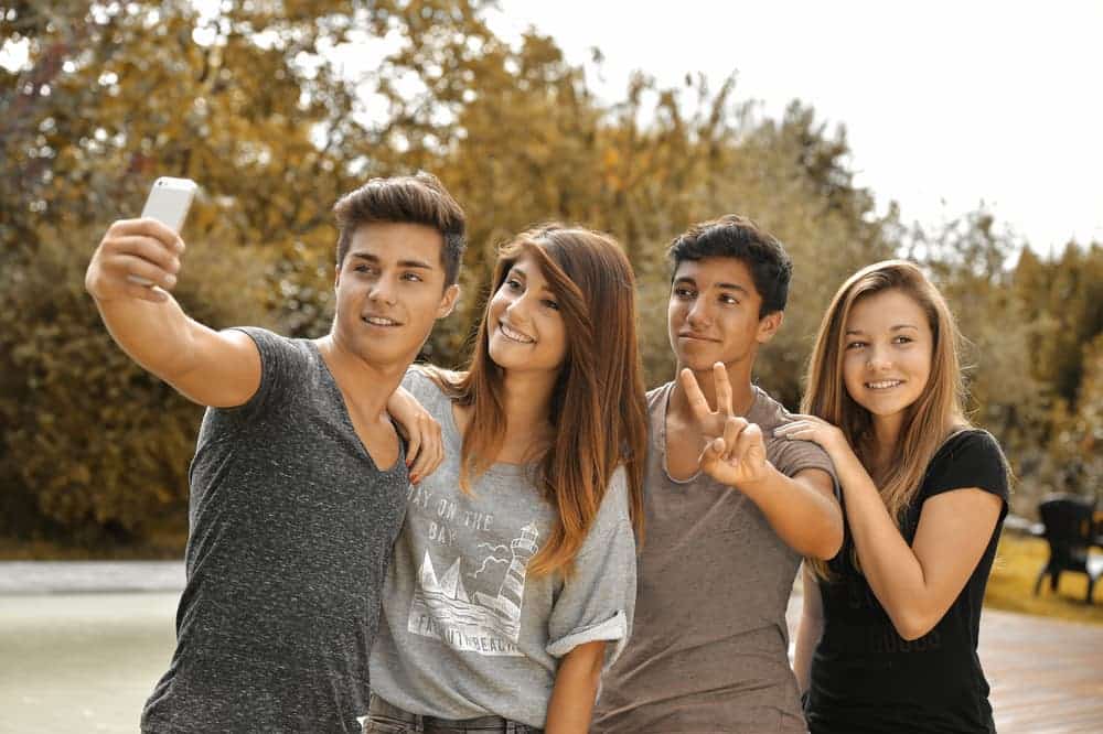 Teens taking a selfie - Teen development