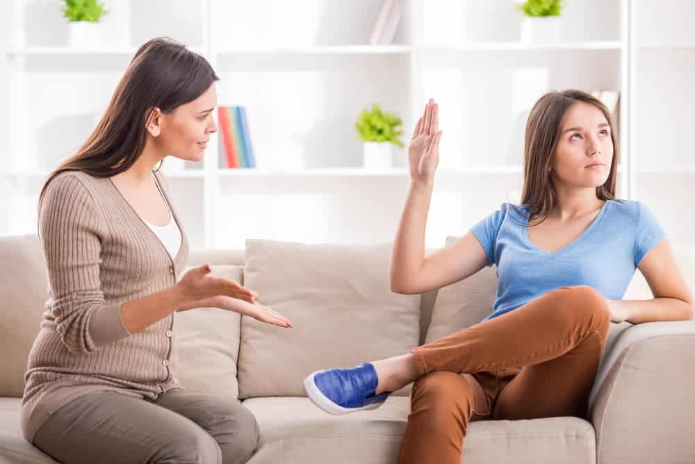 Mom trying to talk to her teen daughter - teens and time-sharing