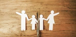 Scissors dividing the whole paper family. -collaborative law when children are involved