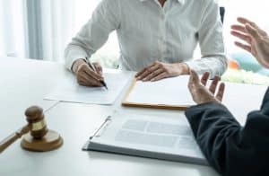 Businesswoman and Male lawyer or judge consult and conference having team meeting with client at law firm in office, Law and Legal services concept.
