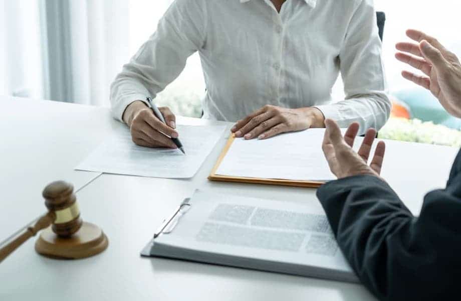 Businesswoman and Male lawyer or judge consult and conference having team meeting with client at law firm in office, Law and Legal services concept.
